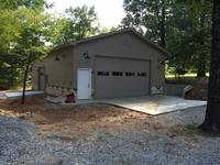 Metal Building Garage with Stone Accents